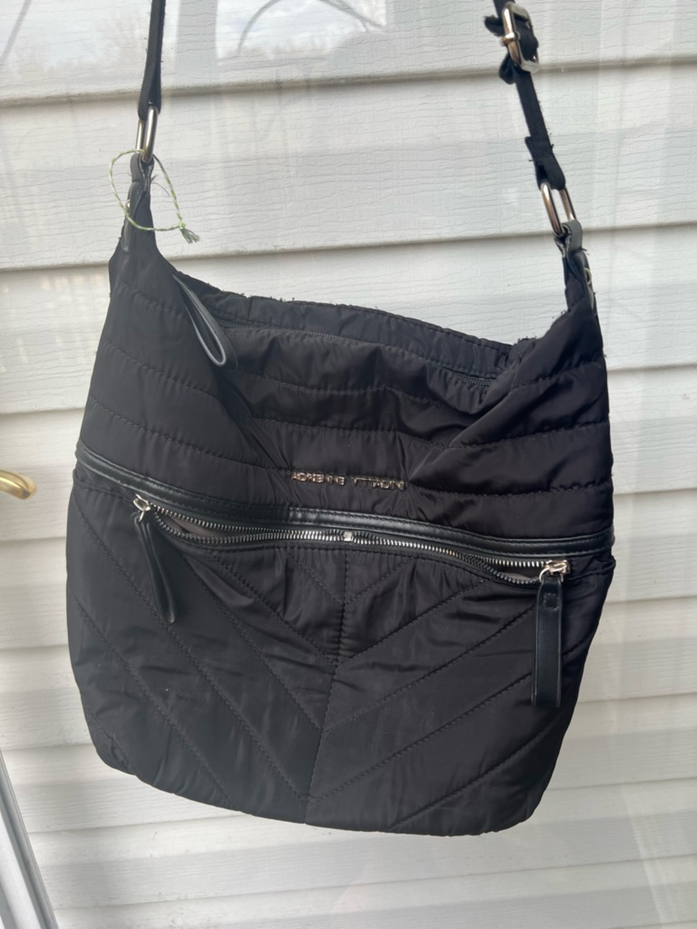 The Adrienne Vittadini black fabric crossbody bag